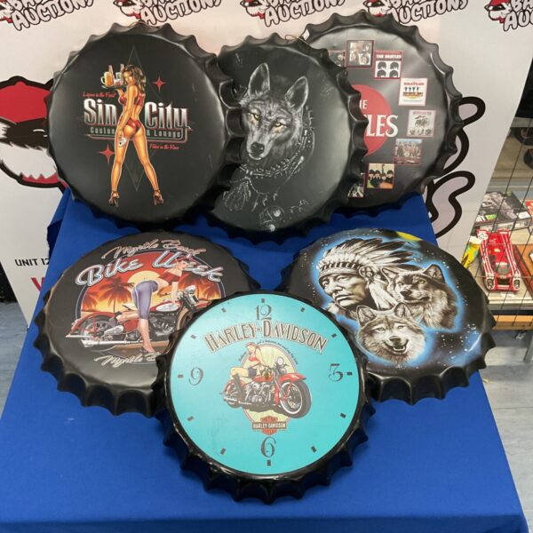 Collection of vintage-style bottle cap wall art pieces.