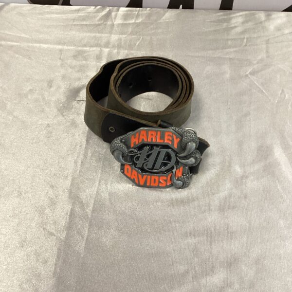 Close-up of vintage Harley Davidson leather belt buckle.