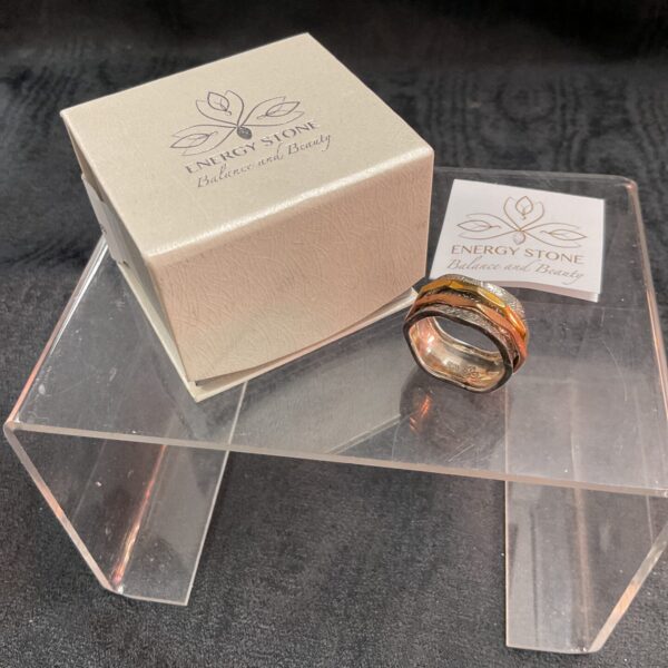 Silver spinner ring by Energy Stone with rotating bands.