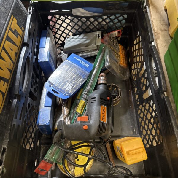 Assorted drill bits and tools in a plastic tray.
