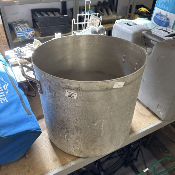 Large stainless steel cooking pot for commercial use.