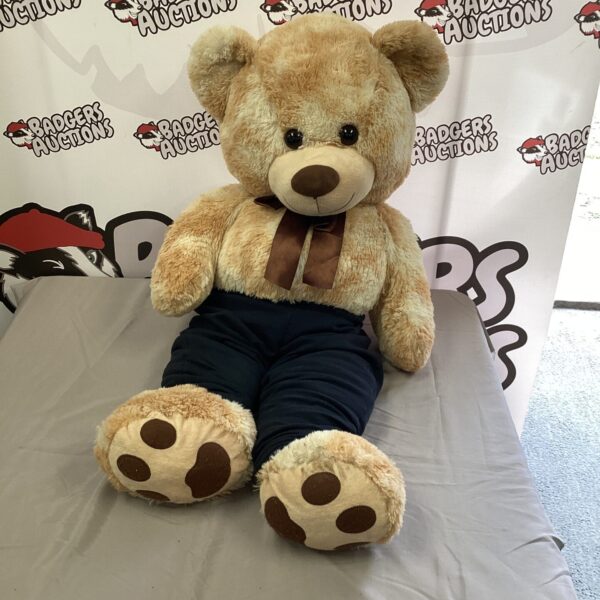 Large teddy bear, vintage plush toy, soft and huggable.