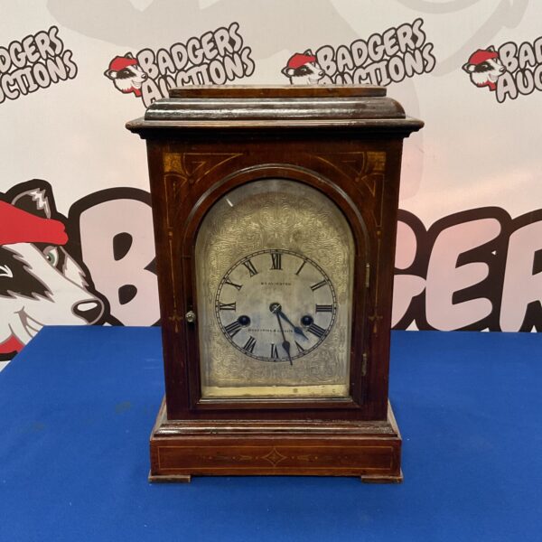 Front view of a Victorian mantle clock by Bravingtons.