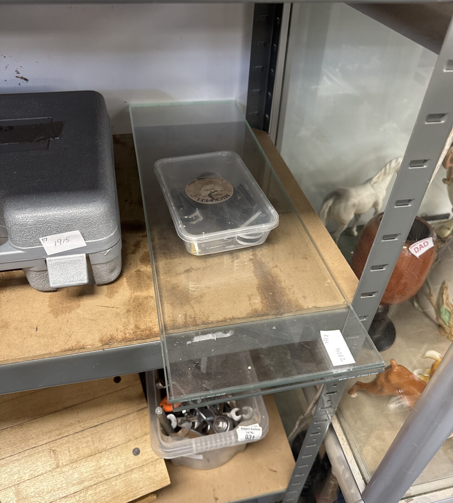 Three glass floating shelves with wall brackets