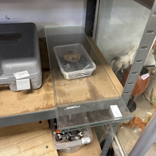Three glass floating shelves with wall brackets