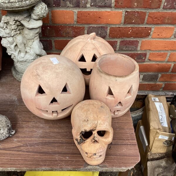 Set of four vintage garden Halloween ornaments for spooky outdoor decor.