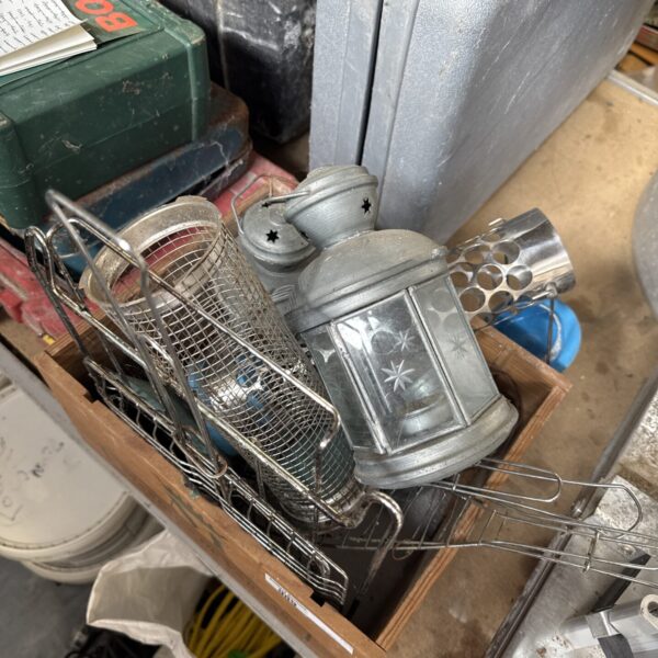 Vintage metal lantern with decorative detailing, ideal for collectors.