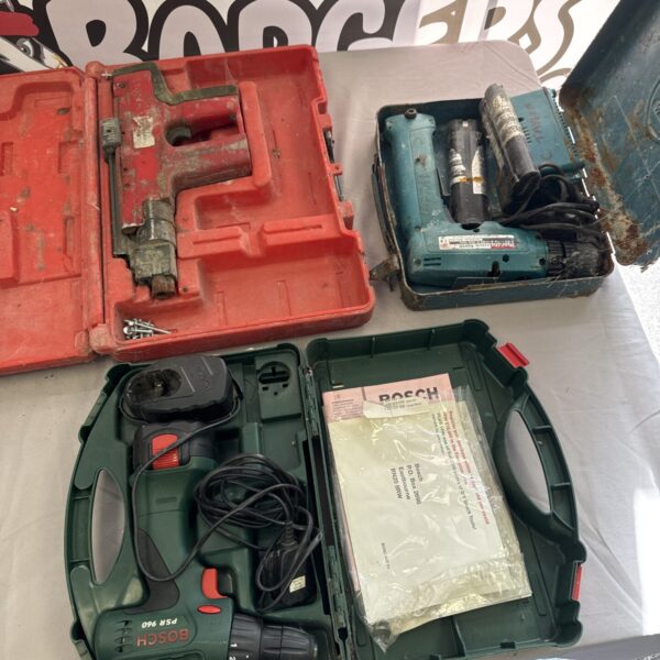 Vintage Bosch power tools lot with carrying cases, including a drill.