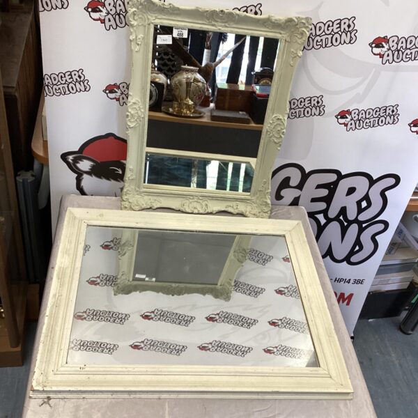Two wooden framed wall mirrors