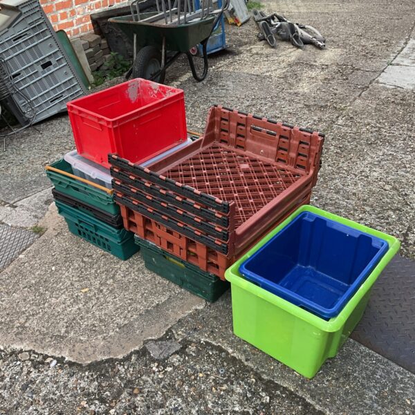 Large lot of colourful plastic storage crates for garden and home.
