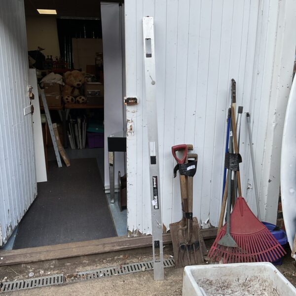 Trend hinge jig positioned in a workshop doorway.