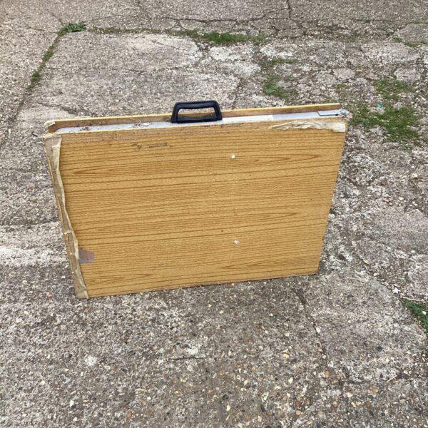 Vintage folding table with carry handle, ideal for camping.
