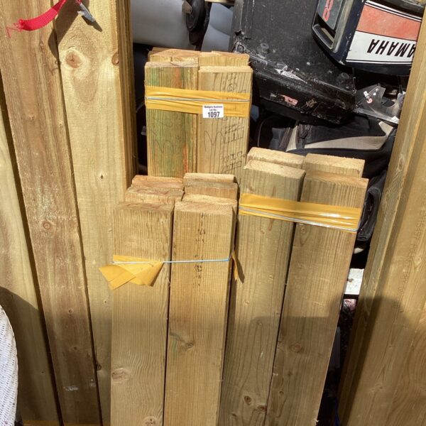 Three bundles of timber for garden and DIY projects.