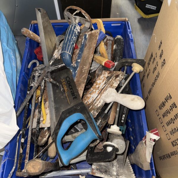 Rusty hand tools in a shed clearance lot for DIY projects.