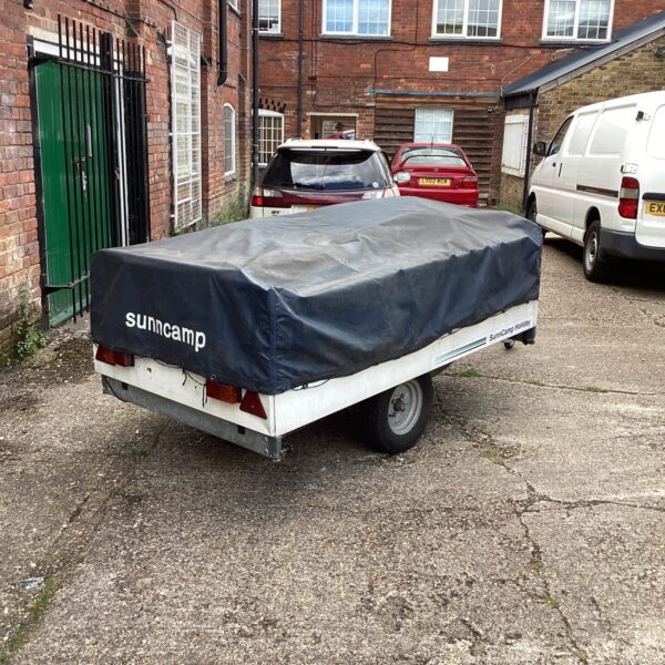 Suncamp Holiday trailer tent parked in a driveway.