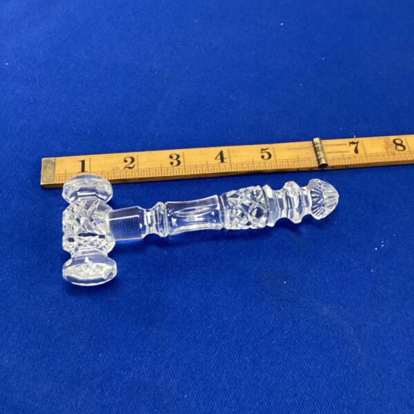 Waterford crystal gable displayed with ruler for scale.