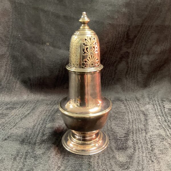 Vintage silver plate sugar sifter with pierced detail.