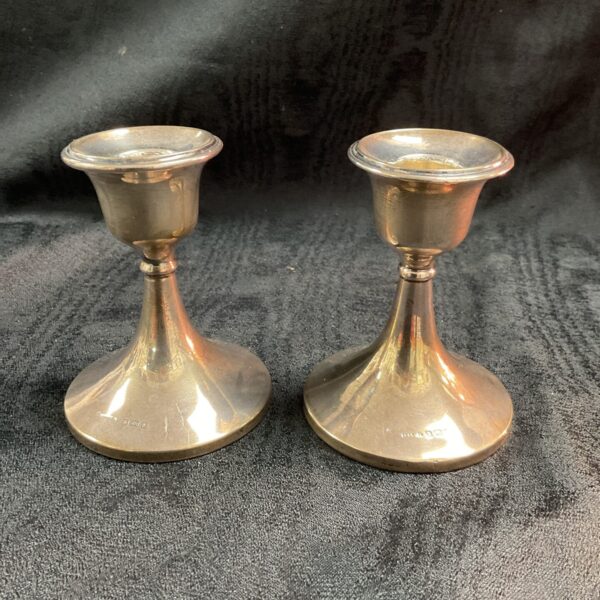 Antique silver candlesticks, a hallmarked pair for collectors.