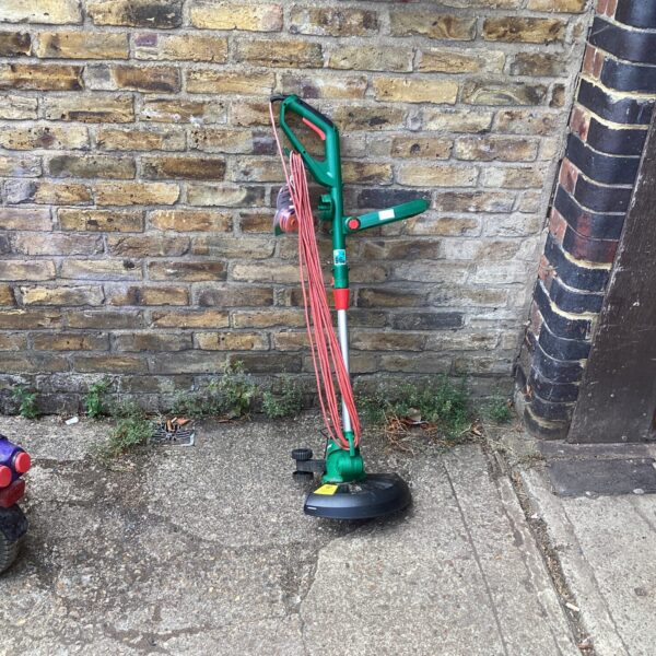 Qualcast electric garden strimmer for lawn and edge trimming.