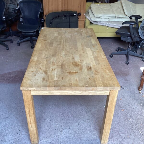 Solid oak butchers block table, ideal for kitchen or workshop use.