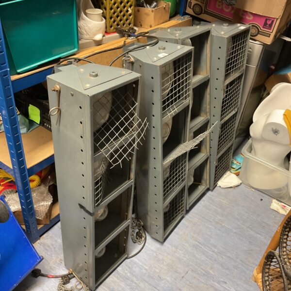 Four vintage industrial caged lights with enamel finish.