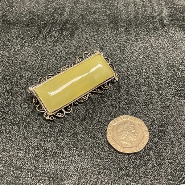 Vintage jade cushion cut brooch with filigree setting 5 cm long