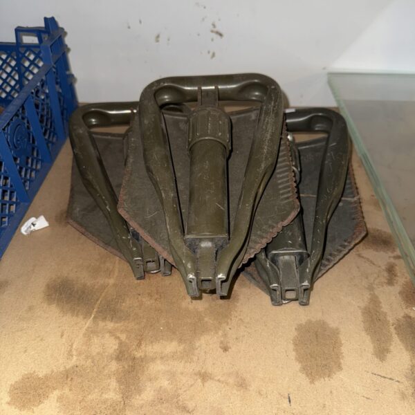 Lot of three vintage military folding shovels for sale.