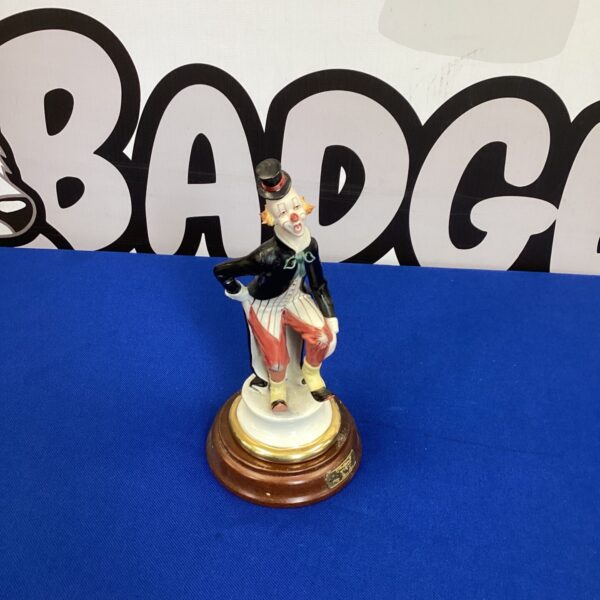 Vintage Epoca porcelain clown figurine on a gilded base.