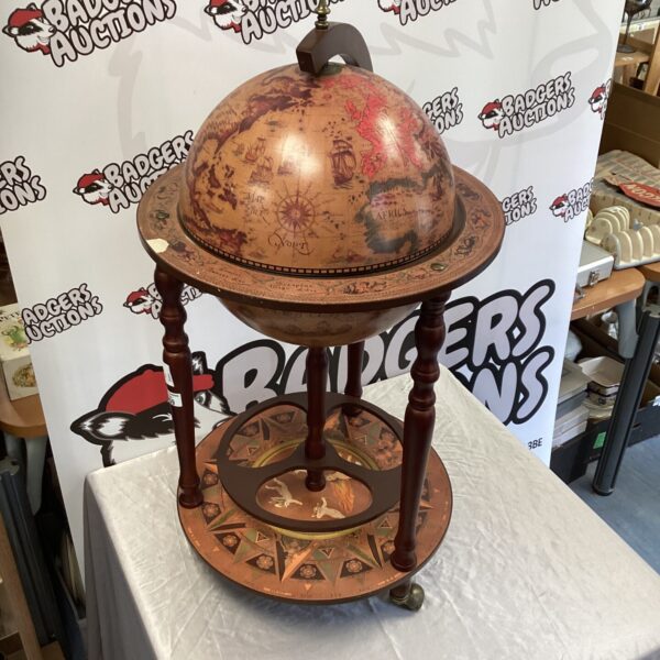 Vintage globe drinks cabinet, a stylish retro home bar piece.