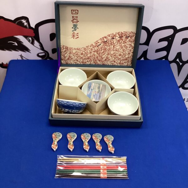Vintage Chinese rice bowl set displayed on a surface.