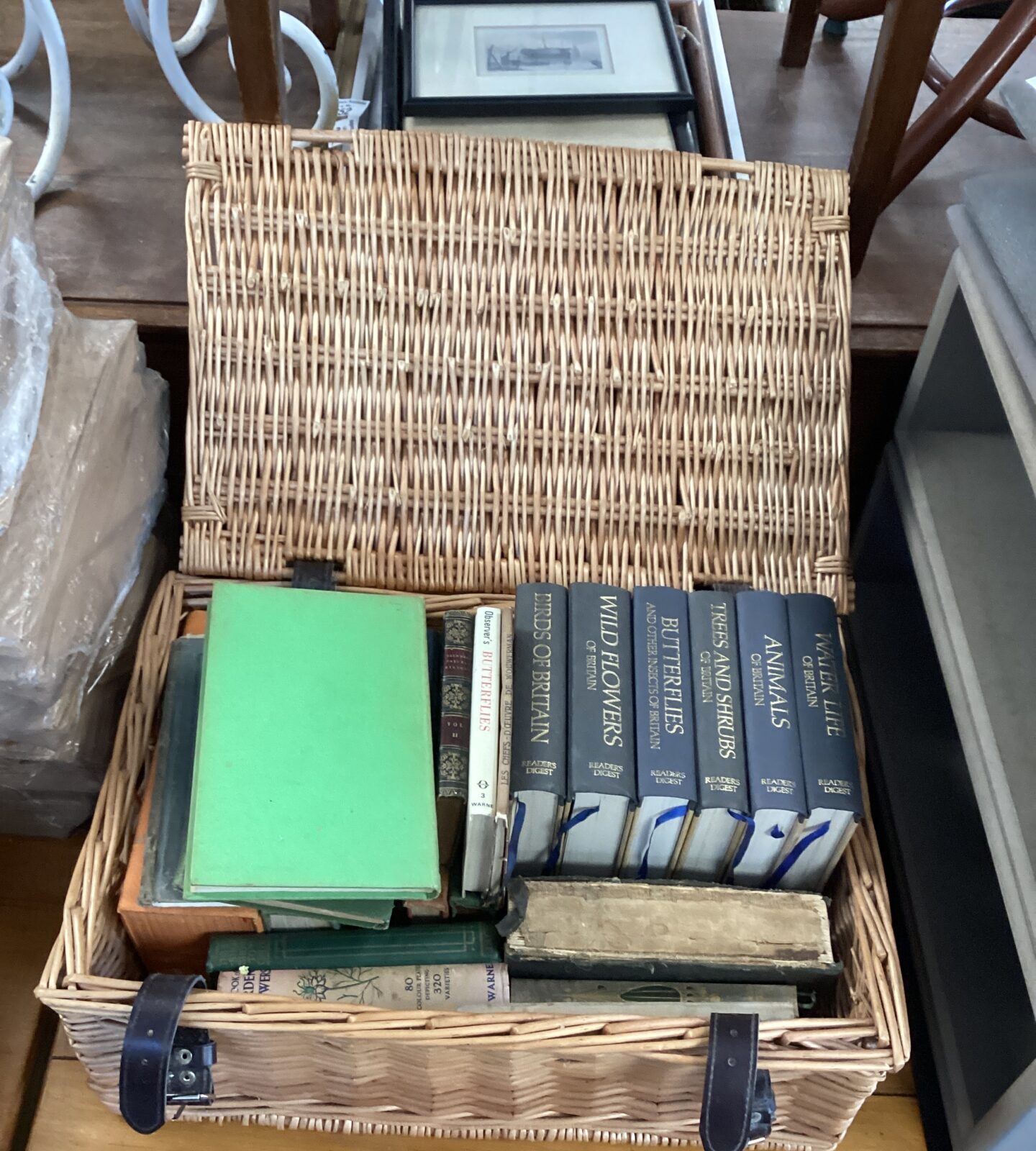 Wicker basket containing Reader Digest books