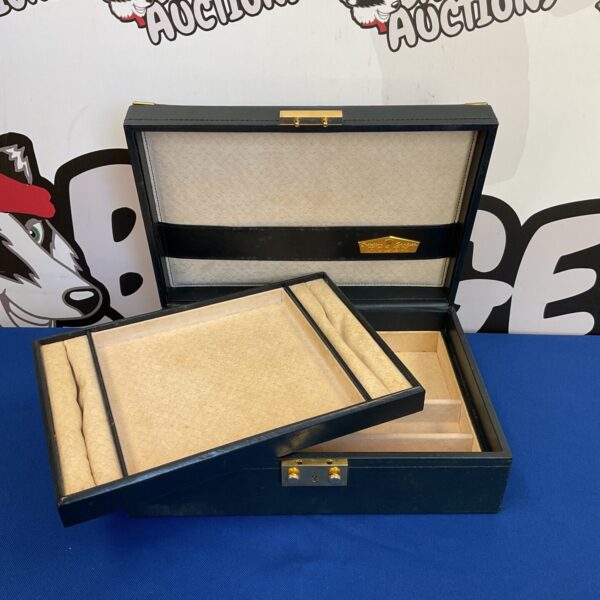Vintage Rolex leather jewellery box, green exterior, luxury storage.