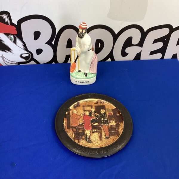Bretby wall hanging plate and WG Grace Figurine