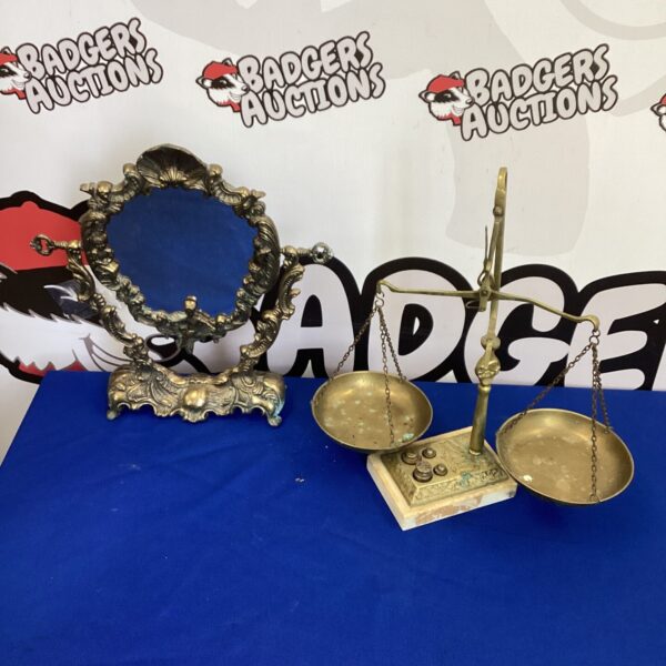 Vintage brass balance scales and ornate mirror set for collectors.