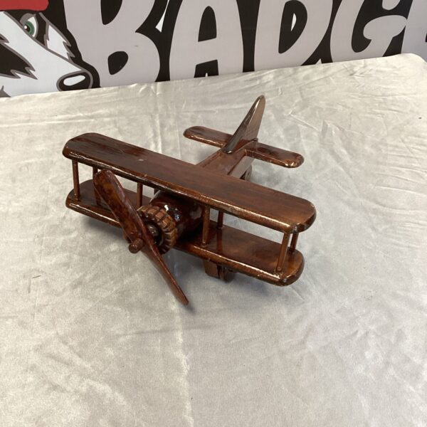 Vintage wooden biplane model, a charming decorative airplane.