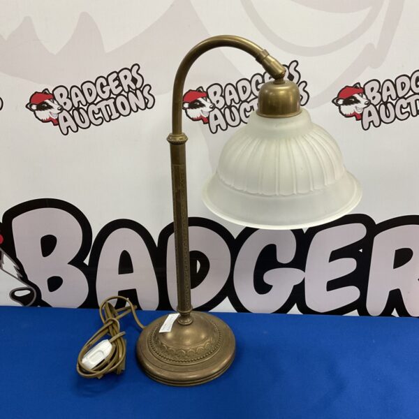 Vintage art deco brass table lamp with frosted glass shade.