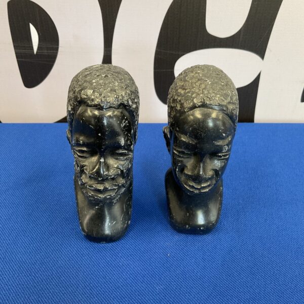 Pair of vintage carved stone busts of tribal elders