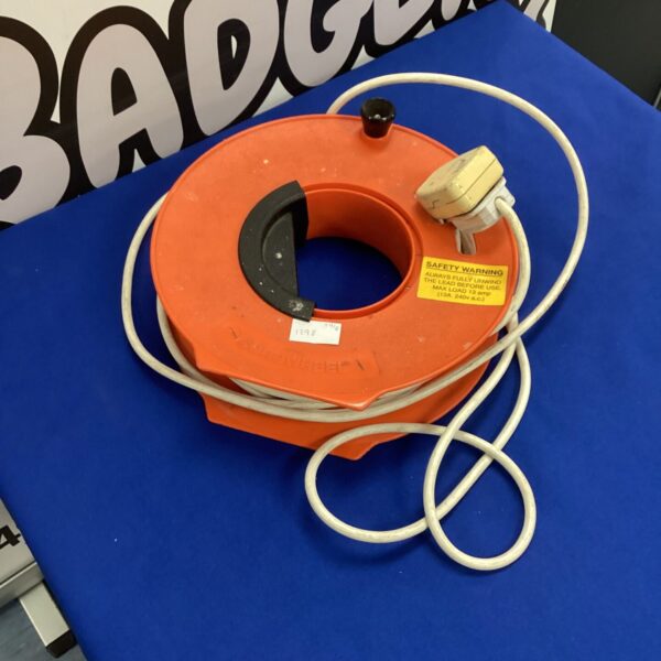 Vintage electrical extension reel with yellow plastic casing.