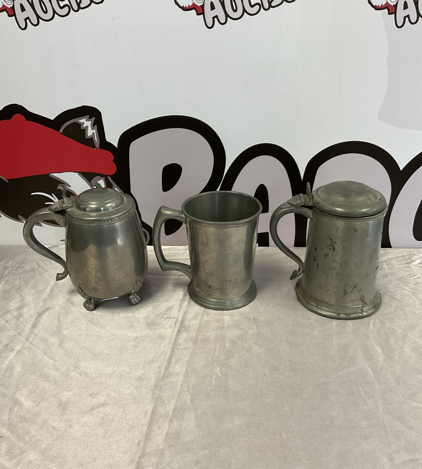 Three vintage pewter tankards including culfonia