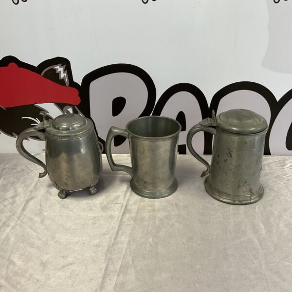 Three vintage pewter tankards including culfonia