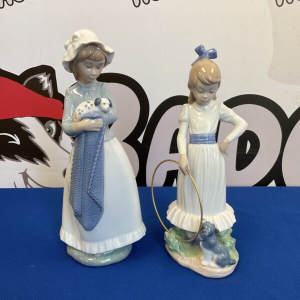 Pair of vintage Lladro Nao porcelain figurines with flowers.