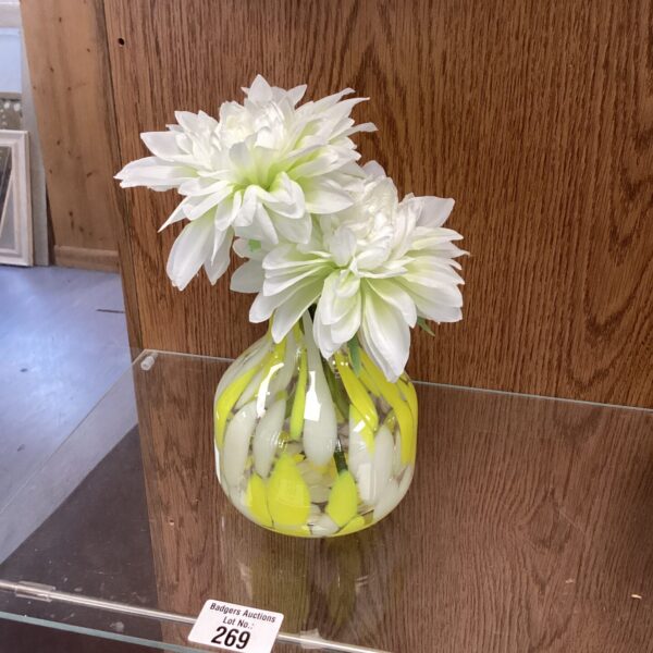 Clear glass designer vase for floral arrangements and home decor.