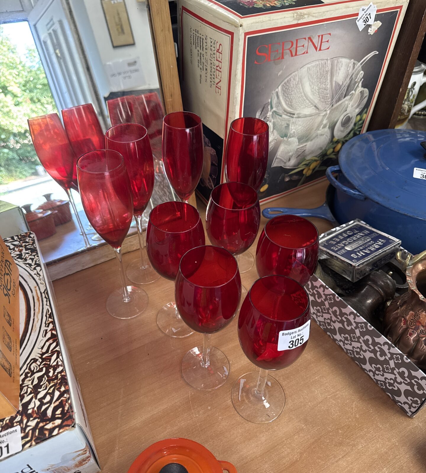 Nine assorted cranberry glass champagne flutes & wine glasses