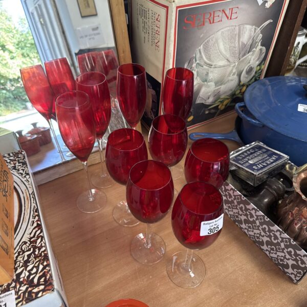 Nine assorted cranberry glass champagne flutes & wine glasses