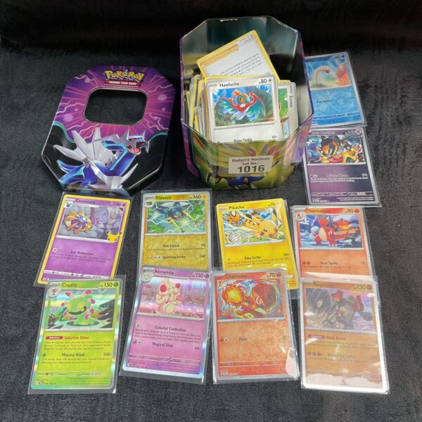 Pokemon card tin with a collection of trading cards inside.