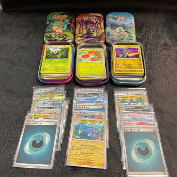 Pokemon card tins set, collectible trading cards, Pokemon collection.