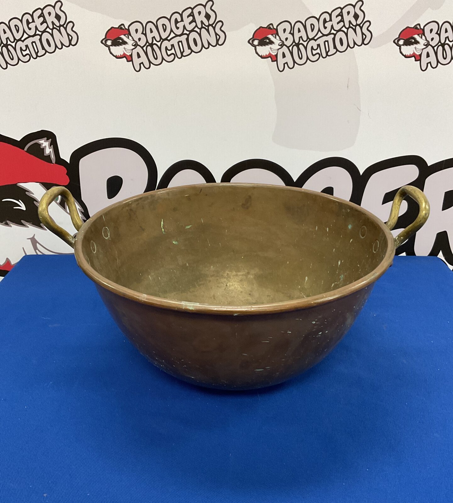 Large antique copper bowl with brass handles