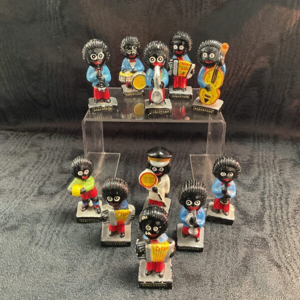 Vintage Robertson golly musicians collection, colourful collectible figures.