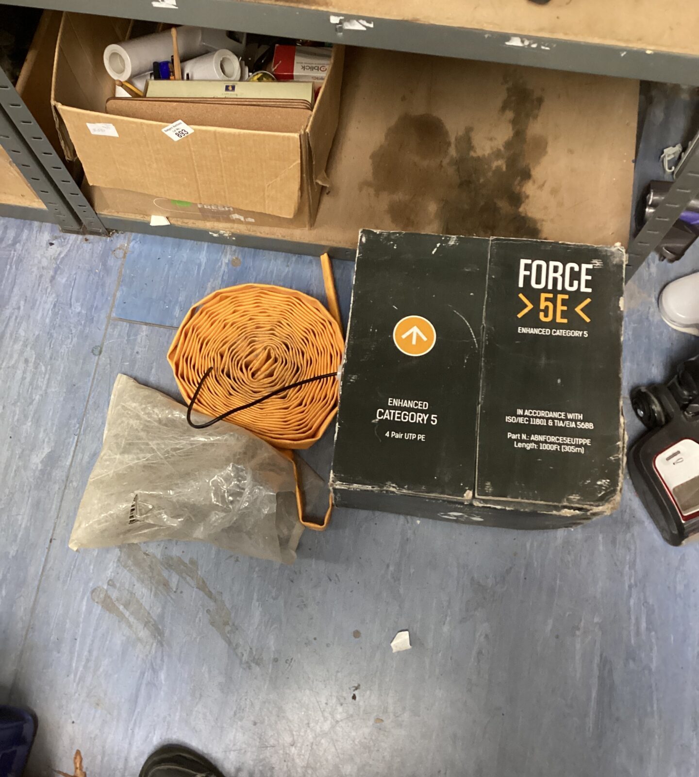 Box of cat5e network cable, roll of hose & a bag of wall ties