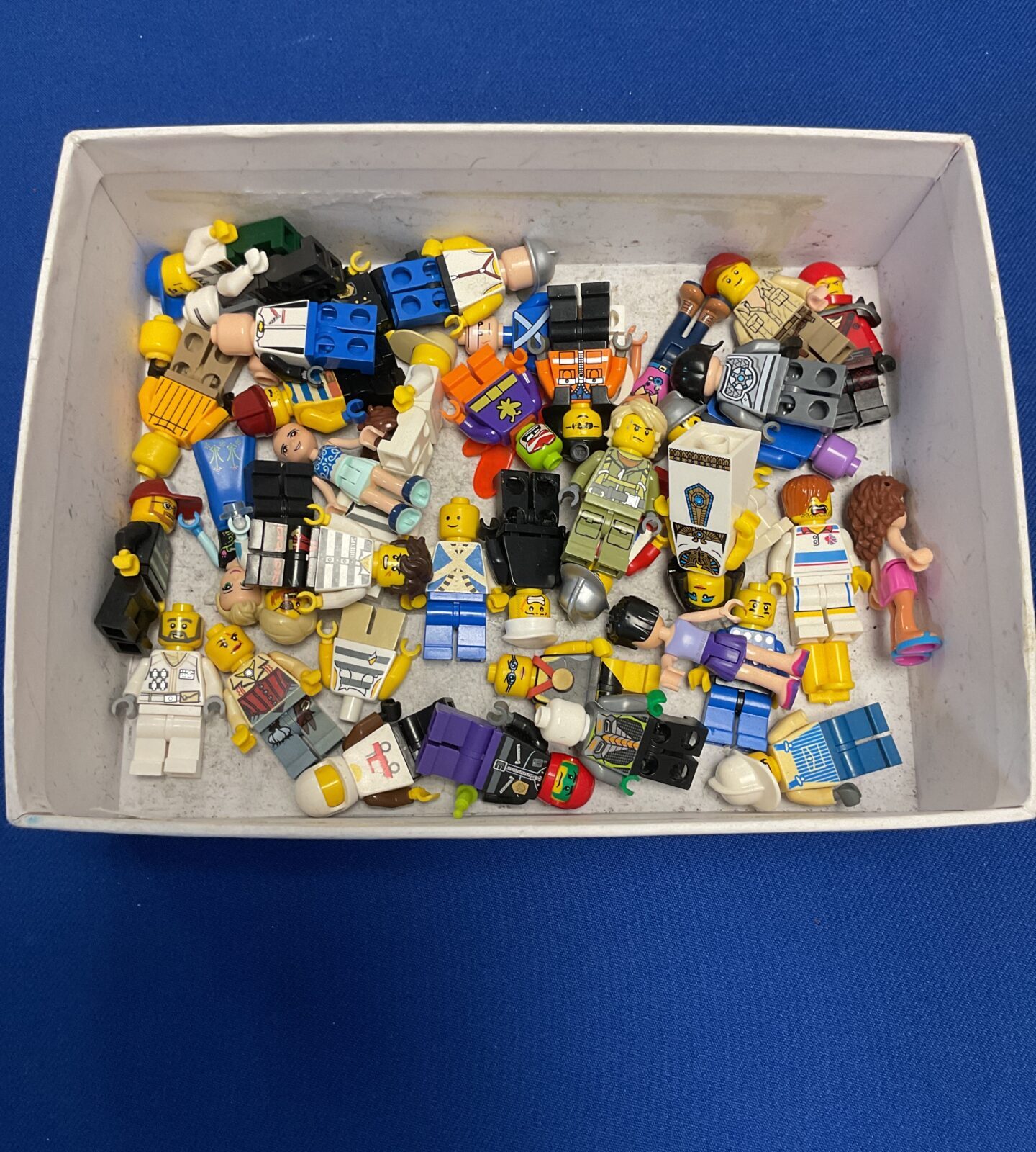 Box of mixed lego minifigures and accessories